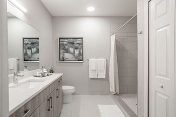 Bathrooms Fitted with Oversized Custom Vanities, Undermount Sinks, and Quartz Countertops